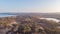 An aerail view of the Studland Nature Reserve with sand dune, peat bog, sea and lake under a majestic blue sky