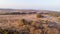 An aerail view of the Studland Nature Reserve with sand dune, peat bog and sea under a majestic hazy blue sky