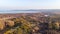 An aerail view of the Studland Nature Reserve with sand dune, peat bog, sea and white cliff in the background under a majestic blu