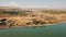 Aeral dolly over Lake Capernaum, shore view, Orthodox Church of the 12 apostles. The coast of Sea of Galilee, top view