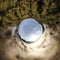 Aerial 360-degree shot of dense green forests and white clouds in blue sky