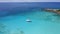 Aerial 4k drone footage of lonely catamaran yacht in crystal clear turquoise lagoon water on tropical La Digue Island