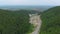 Aerial 4k drone video of top vew of winding road in the mountains