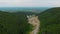 Aerial 4k drone video of top vew of winding road in the mountains