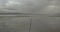 Aerial 4K - Flying along a fence in a flooded lake in the Australian Outback