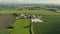 Aerial 4K footage of a farm between fields in North Yorkshire, UK