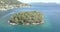 Aerial 4K - Island in idyllic Mediterranean coastal town