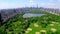 Aerial 4k video above green Central park in the middle of Manhattan, New York