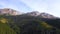 AERIAL above  larch and spruce forest and mountain peak in autumn. Beautiful mountain forest. Fall season. Bucegi mountains. Roman