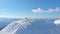 AERIAL: Active male tourist enjoying the stunning sights of snowy mountain range