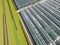 Aerial agricultural view of lettuce production field and greenho