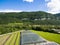 Aerial agricultural view of lettuce production field and greenho