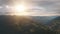 Aerial Alps sunset mountain ridge forest. Sun nature landscape at summer day. Cinematic Drone Flight