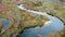 Aerial arc view on river curve in autumn valley