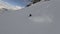 Aerial around view extreme man snowboard downhill freeride on snowy mountain