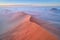 Aerial, artistic photo of dunes of Namib desert covered on mist. Famous orange dunes of Namib from above. Desert landscape.