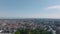 Aerial ascending footage of buildings in historic city centre. Panoramic view of large city in flat coastal landscape