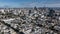 Aerial ascending footage of buildings in metropolis. Gradually revealing modern skyscrapers in Financial District.