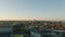 Aerial ascending footage of historic buildings in city at golden hour. Majestic dome of Frederiks Church towering above