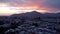 Aerial ascending footage of a sunset over the mountains at Talagante, Chile