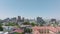 Aerial ascending shot of buildings in city on sunny day, Multistorey commercial houses and clear blue sky. Cape Town