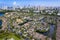 Aerial of Aventura Lakes, a high-end residential community, with skyline of Sunny Isles Beach in the distance