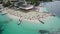 Aerial, Azure Beach with Empty Sun Loungers and Boats, Balkan Sea Coast, Albania