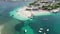 Aerial, Azure Beach with Empty Sun Loungers and Boats, Balkan Sea Coast, Albania