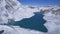 Aerial backwards view spectacular panorama of beautiful blue alpine Tilicho lake and surrounded high Himalayas mountains
