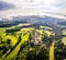 Aerial Bad Toelz Bavarian Alps. Golf Course. Blomberg Mountain. Morning Drone Shot with some clouds in the sky