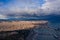 Aerial Barcelona panorama before storm. City with shadows from clouds. Moody weather. Spring in Barcelona Spain