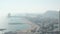 AERIAL: Barcelona, Spain Wide Drone Shot of City and Ocean with Boats in the Bay