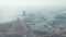 Aerial: Barcelona wide drone shot of city towards beautiful blue ocean and bay