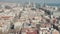 Aerial: Barcelona wide drone shot of city towards skyline cityscape