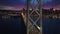 Aerial Bay Bridge with Embarcadero and Financial District skyscraper buildings