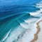 Aerial beach top view above seashore with blue wave and white frothy summer