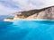 Aerial beautiful beach and water bay in the greek spectacular coast line. Turquoise blue transparent water, unique rocky cliffs,