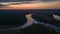 Aerial beautiful landscape view of curved river at sunset time