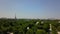 AERIAL: Beautiful Paris Cityscape revealing behind Trees in Summer sunshine