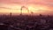 AERIAL: Beautiful View of Berlin TV Tower Alexanderplatz with with smoke on rooftops at Sunrise in Red morning light