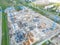 Aerial Bird Eye View Of a Construction Site Building Cranes Looking Down Industrial Machinery Area around Residential Urban