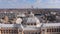 Aerial bird Fly away view on a Flag on the top of Kurhaus of Scheveningen Located on Dutch coastline. Long sandy beach a