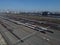 Aerial bird view photo of railroad container terminal with train loaded with containers by overhead crane also showing