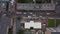 Aerial birds eye overhead top down tracking view of car giving way to oncoming traffic in narrow town street. London, UK