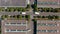 Aerial birds eye overhead top down view of trucks cars manoeuvring in an industrial site. Industry, logistic and