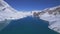 Aerial birds eye view blue alpine Tilicho lake surrounded by snowy Himalayas mountains range in Nepal. Manang district