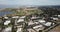 Aerial birds eye view of corporate tech offices Fly forward Google campus shoreline amphitheater