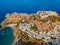 Aerial birds eye view drone photo of village Lindos, Rhodes island, Dodecanese, Greece. Sunset panorama with castle, Mediterranean