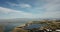 Aerial birds eye view of shoreline lake Google campus amphitheater park mountain background