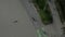 AERIAL birds view flight over Venice Beach board walk with palm trees and bike lane, Sunny, Los Angeles California